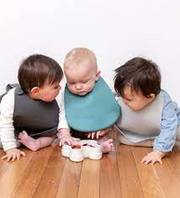 We Might Be Tiny Catchie Silicone Bibs