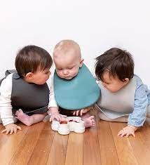 We Might Be Tiny Catchie Silicone Bibs